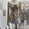Horn long sleeved T-shirt with irregular ruffle edge and ribbon top