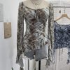 Horn long sleeved T-shirt with irregular ruffle edge and ribbon top