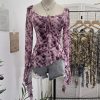 Horn long sleeved T-shirt with irregular ruffle edge and ribbon top