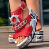 2090a322-5bfc-42f4-8647-ebc349a5ad5a.jpg Newspaper Buckle Denim Wedge Slides - Anklet Not Included