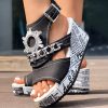 6f86bf42-50e6-4bf5-b4b4-6e6a0c403654.jpg Newspaper Buckle Denim Wedge Slides - Anklet Not Included