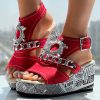 cdd757ed-aaa0-496b-8767-d8e75fd3c83f.jpg Newspaper Buckle Denim Wedge Slides - Anklet Not Included