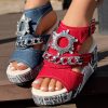 d97578f1-b025-414b-9e90-9ad261b6167f.jpg Newspaper Buckle Denim Wedge Slides - Anklet Not Included